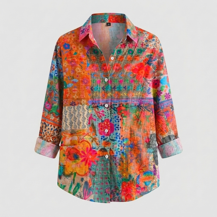 Elegant women's colorful floral blouse with button-front closure. Soft fabric, collared, long sleeves, effortless style.