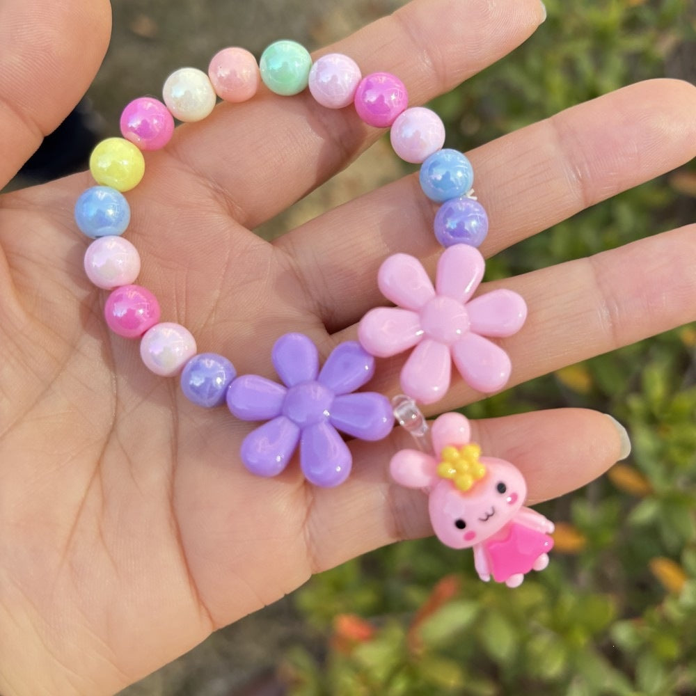 Adjustable women's bracelet showcasing vibrant flower charms, ideal for everyday style.