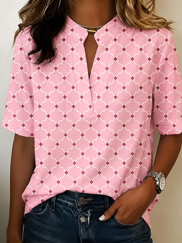 Stylish women's geometric print Henley top, ideal for spring fashion & comfortable summer wear. Colorful, relaxed fit.
