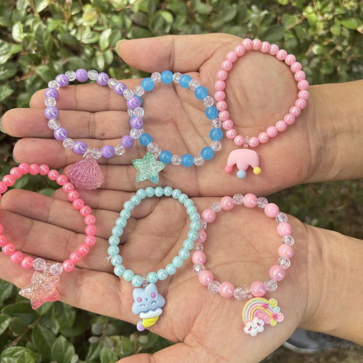 Whimsical women's fashion bracelet, delicate glass beads & cute elephant charm, vibrant everyday wear.