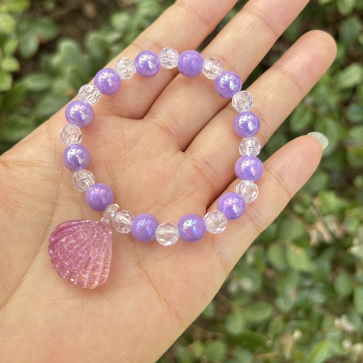 Vibrant glass beaded bracelet for women, featuring a charming elephant pendant, elastic and comfortable.
