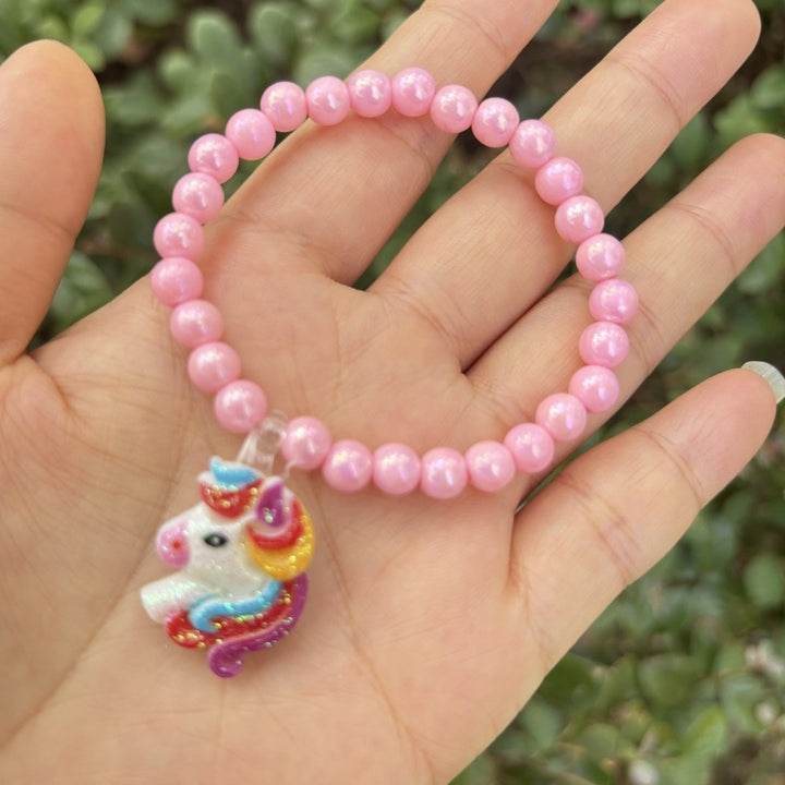 Bright & colorful women's glass bead bracelet, featuring a whimsical elephant charm, a fun fashion piece.