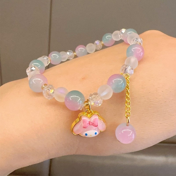 Women's colorful glass bead charm bracelet with various shaped vibrant beads. A playful fashion accessory.