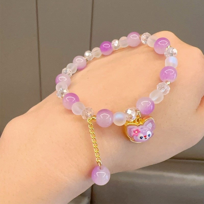 Stunning women's colorful glass bead charm bracelet, a vibrant and playful fashion accessory that catches the eye.