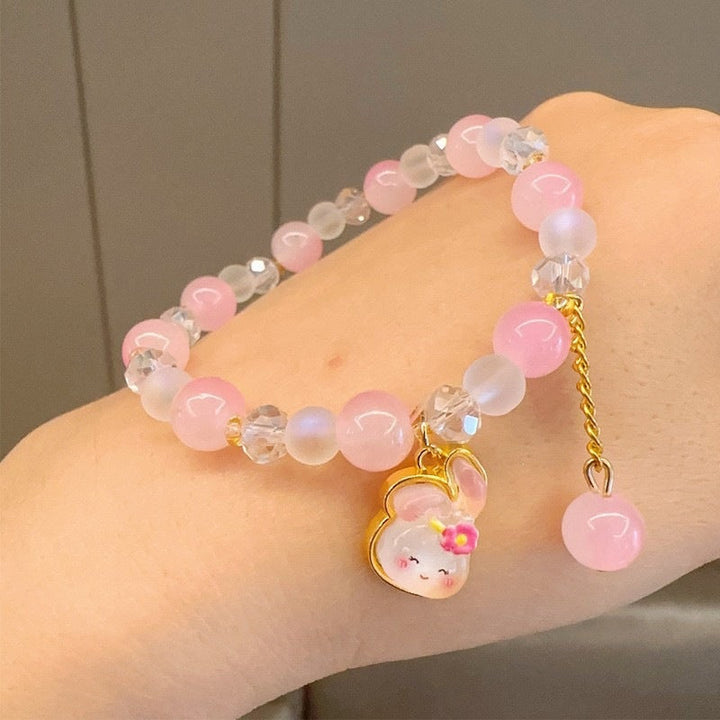 Gift for her: a beautiful women's colorful glass bead charm bracelet. Vibrant and playful fashion jewelry.