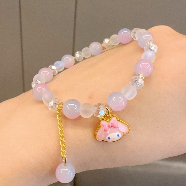 Women's charm bracelet with a mix of colorful glass beads in various sizes and shapes, a vibrant fashion statement.