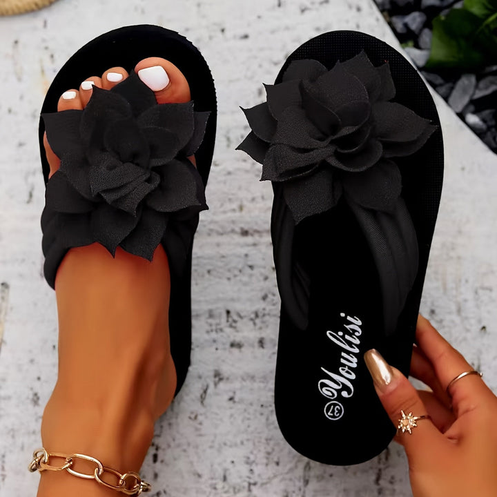 Slip-on comfort platform flip flops for women, vibrant floral details, ideal for warm weather.