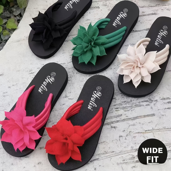 Wide fit women's platform flip flops featuring an elegant floral pattern for ultimate summer comfort.