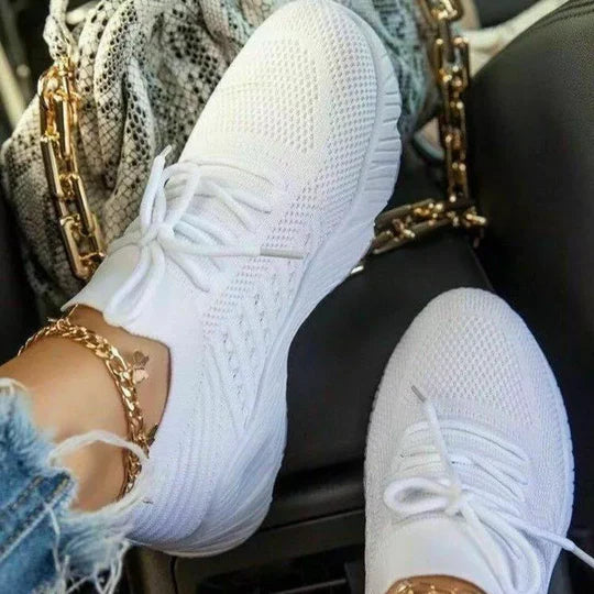 Women's comfort sneakers for everyday wear, featuring cushioned support & stylish design for active lifestyles.