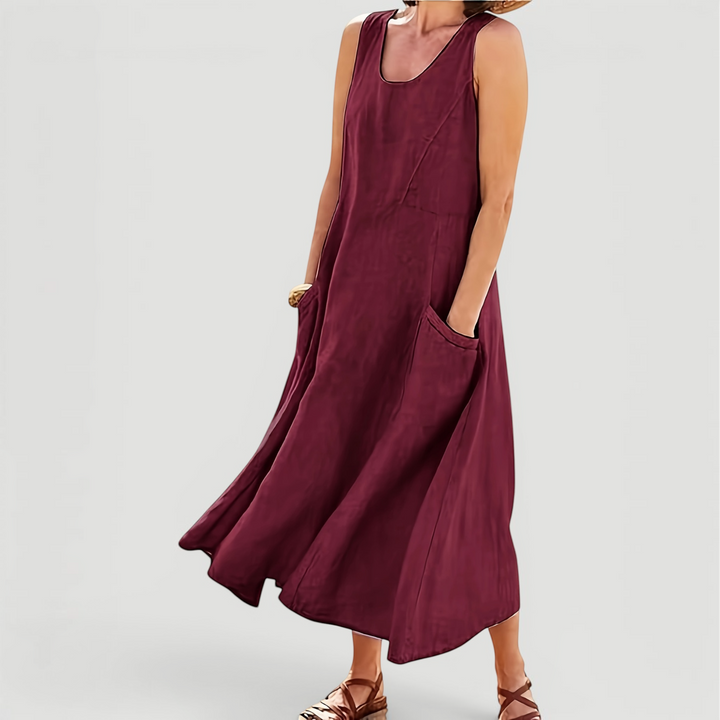 Sleeveless A-line midi dress for women, featuring a round neck & practical pockets, ideal for summer.