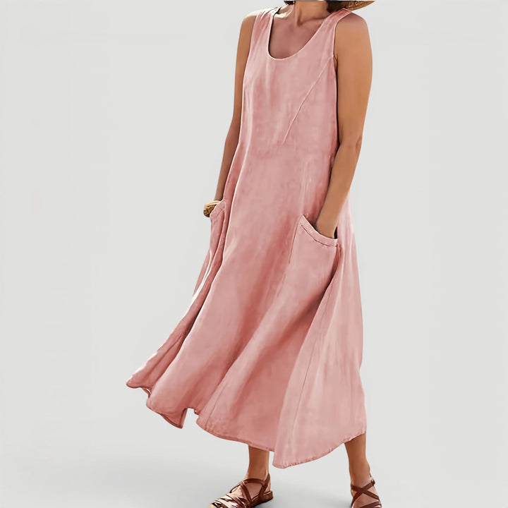 Women's sleeveless A-line midi dress with pockets, comfortable & versatile for casual summer everyday wear.