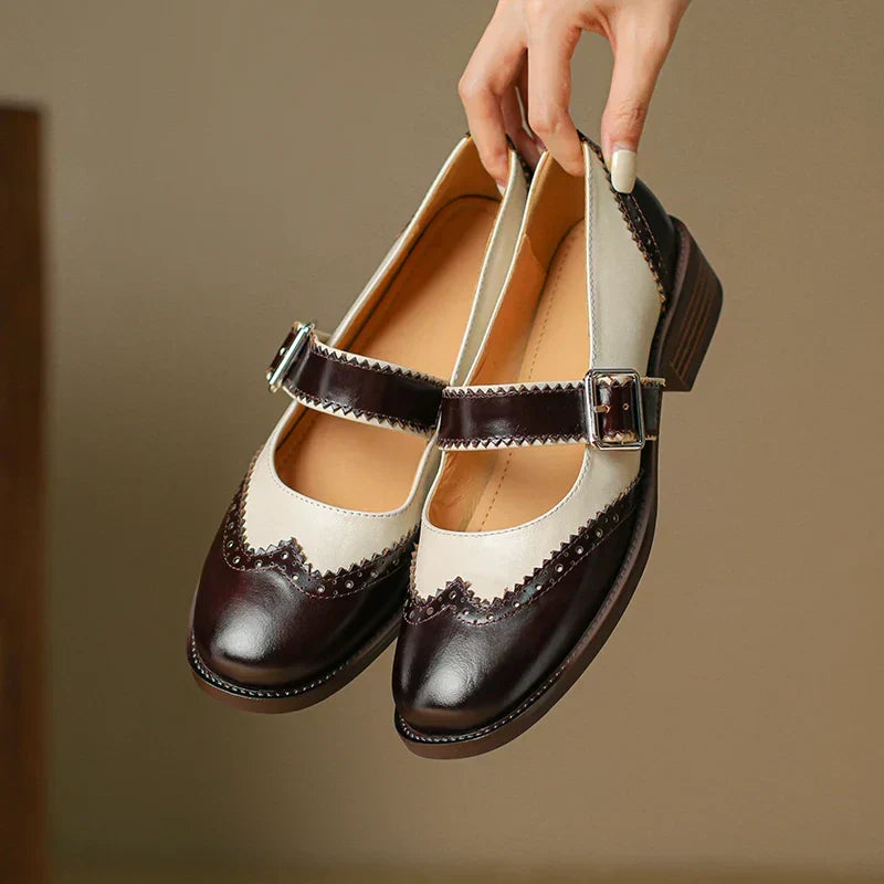 Classic black leather Mary Janes, women's comfortable flats with a secure buckle strap. Ideal for everyday style.