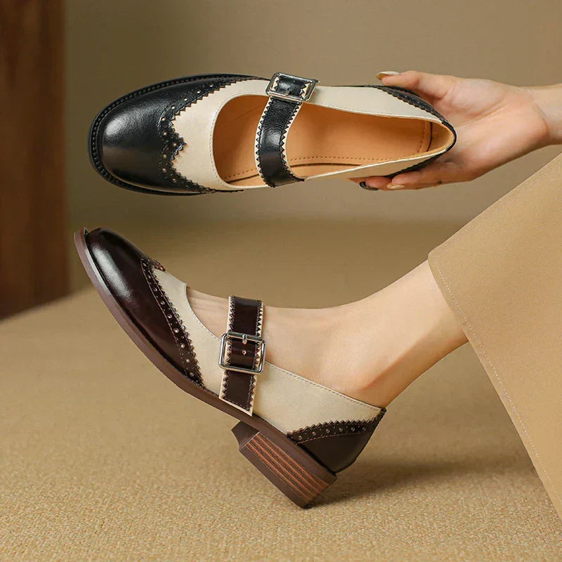 Stylish black leather Mary Janes for women. Practical, comfortable flat shoes with a vintage buckle strap.