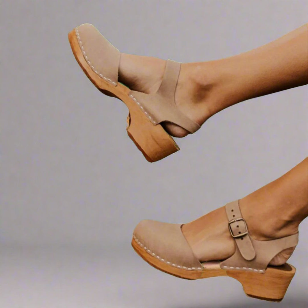 Casual women's summer platform clogs with closed toe, wooden sole, and adjustable ankle strap for comfort.