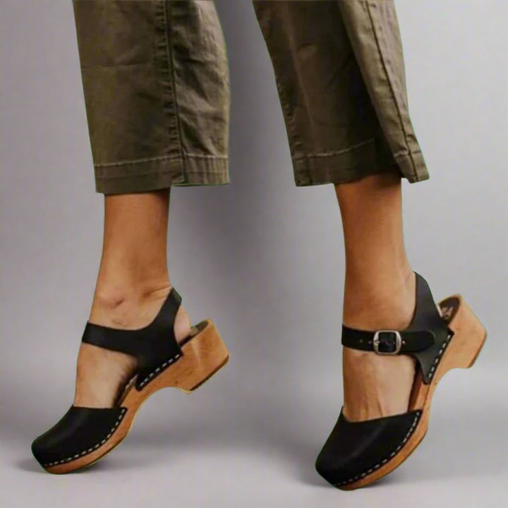 Women's comfortable closed-toe platform clogs with secure ankle strap & trendy wooden sole, retro style.