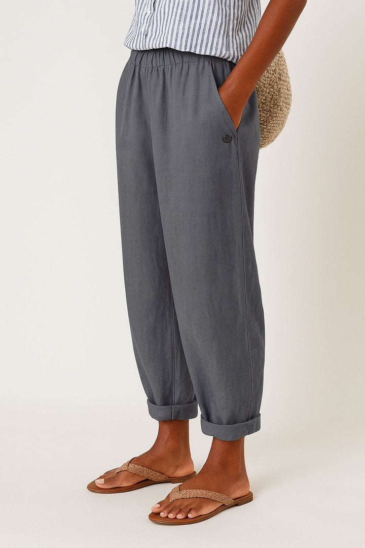 Close-up of elastic-waist detail on women's comfortable linen-look straight-leg trousers.