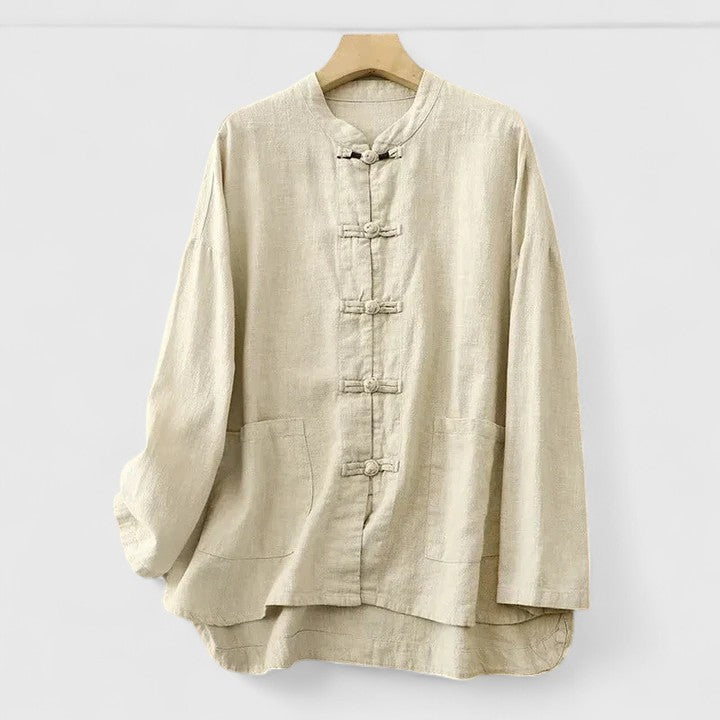 Versatile women's everyday top with a comfortable relaxed fit, trendy knot detail, and practical patch pocket.