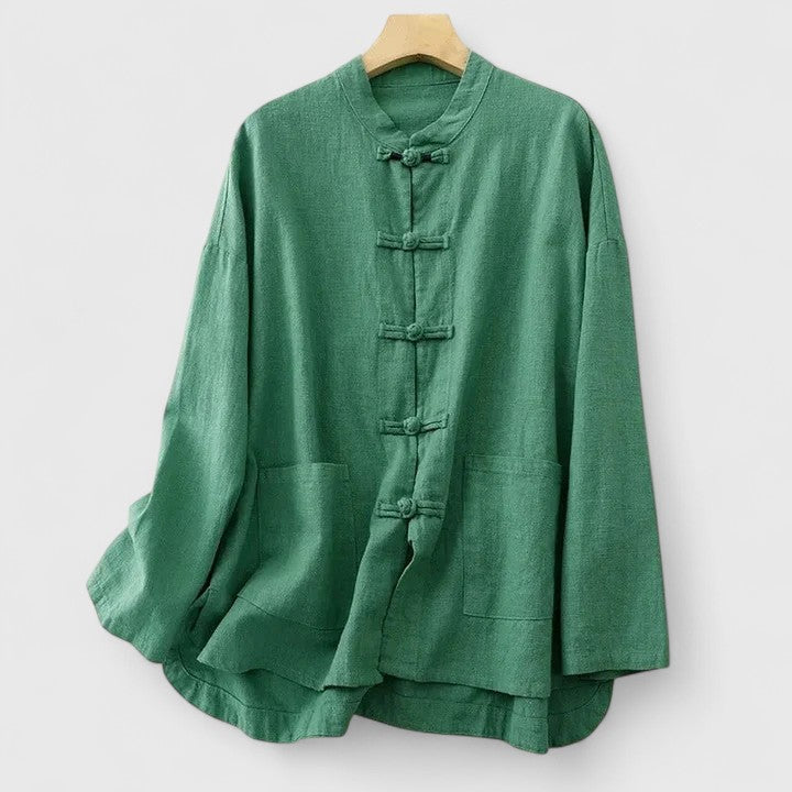 Stylish women's summer top with a relaxed fit, elegant knot detail, and convenient patch pocket for casual fashion.
