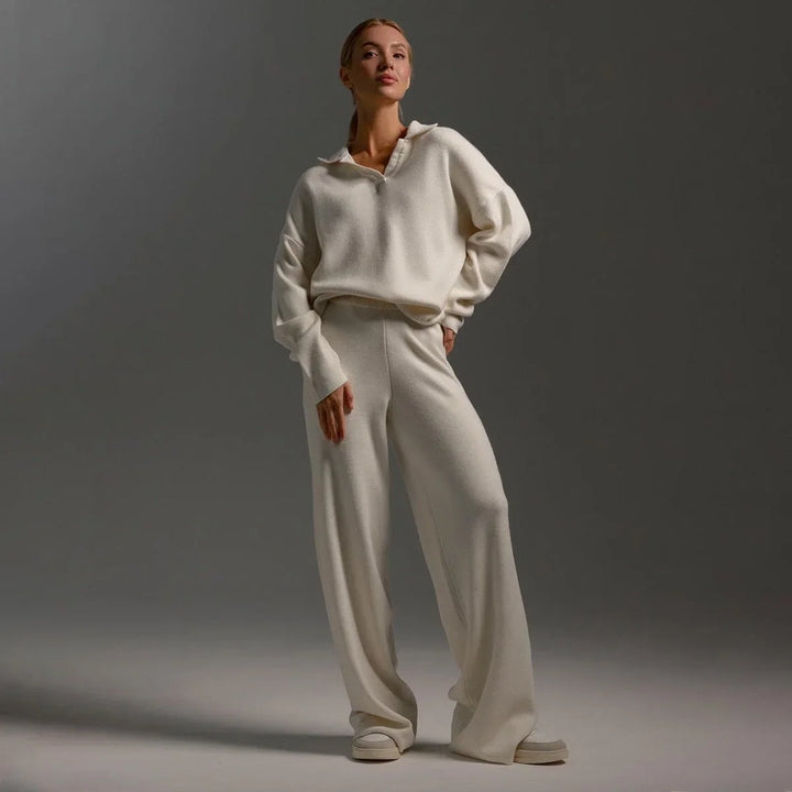 Stylish women's two-piece knit tracksuit featuring a cozy polo-neck sweater & fashionable wide-leg pants.