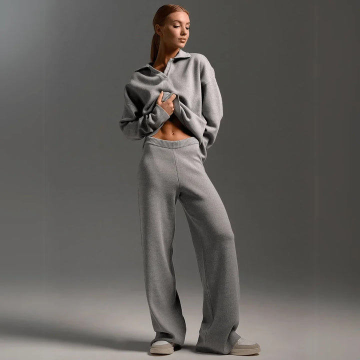 Soft knit women's tracksuit with a ribbed polo-neck sweater & flowing wide-leg trousers. Ideal for loungewear.