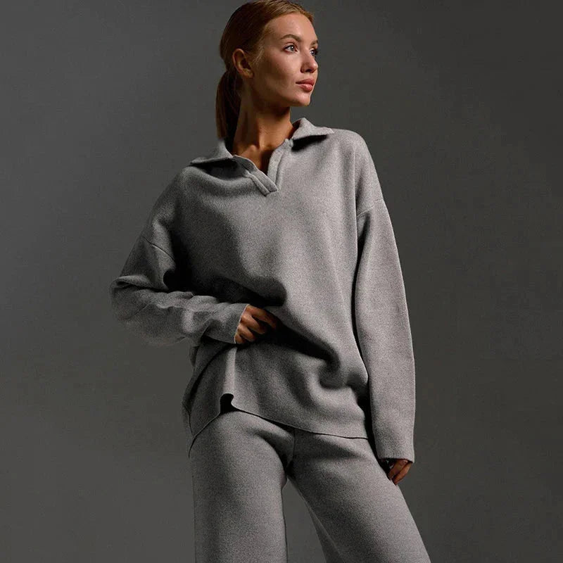 Women's knit two-piece set: a snug polo-neck sweater paired with trendy wide-leg trousers for leisure.