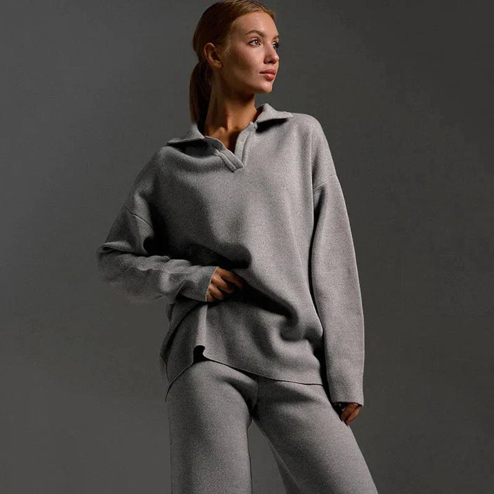 Women's knit two-piece set: a snug polo-neck sweater paired with trendy wide-leg trousers for leisure.