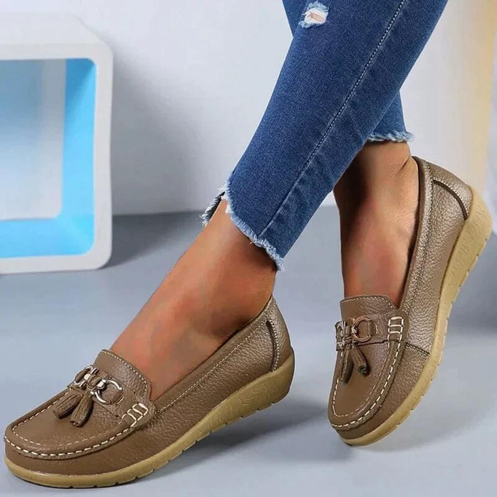 Timeless elegant leather slip-on loafers for women, versatile and everyday footwear.