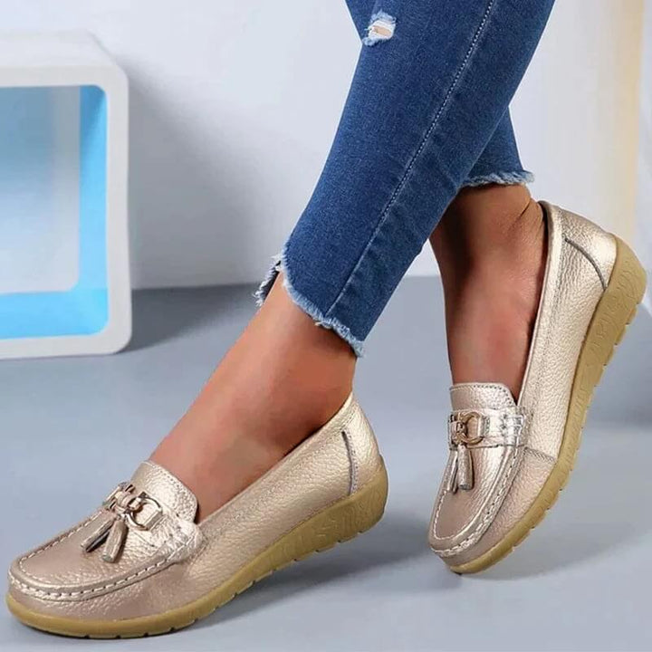 Ladies' comfortable leather flats, elegant slip-on design for timeless everyday style.