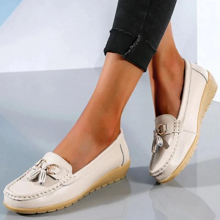 Close-up of women's comfortable leather slip-on loafers, showcasing texture and detail.