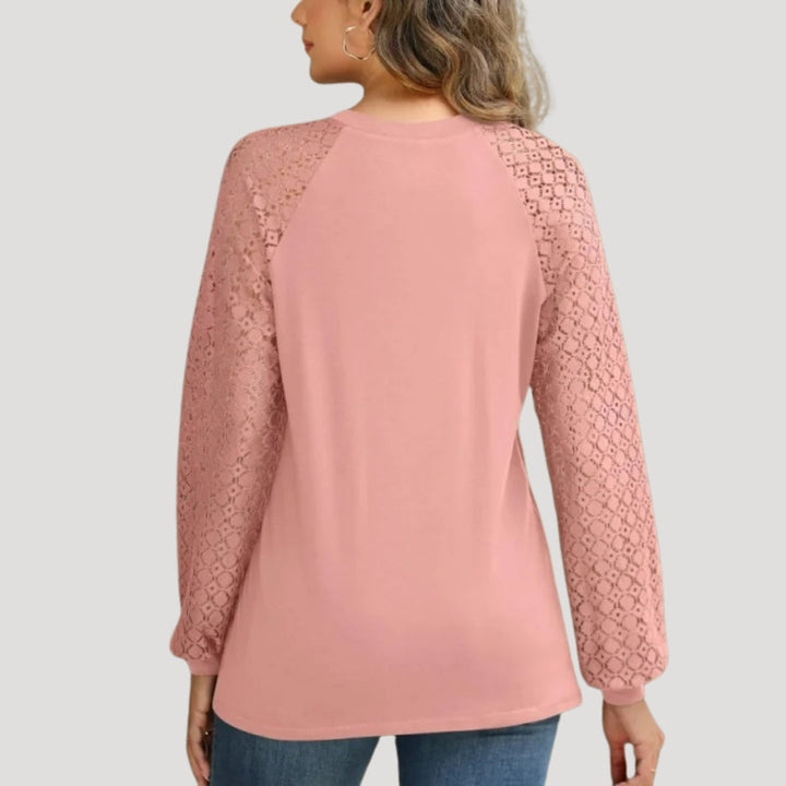 Stylish women's apparel: a comfortable long sleeve top with a versatile design.