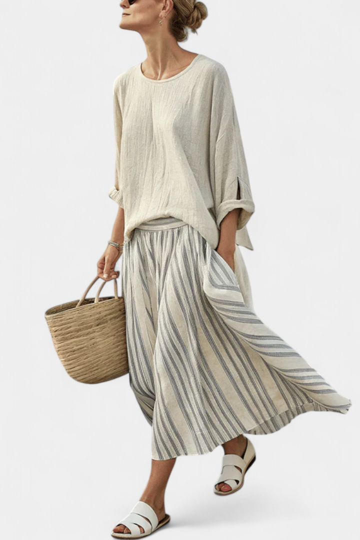 Women's comfortable loose beige blouse & striped midi skirt set. Perfect for casual summer outfits & vacation.