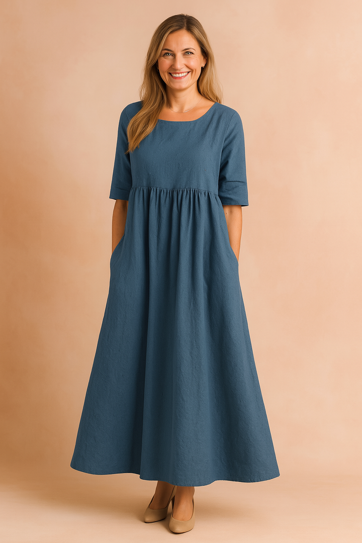 Flowy A-line midi dress for women, ideal for spring & summer. Features comfortable half sleeves and pockets.