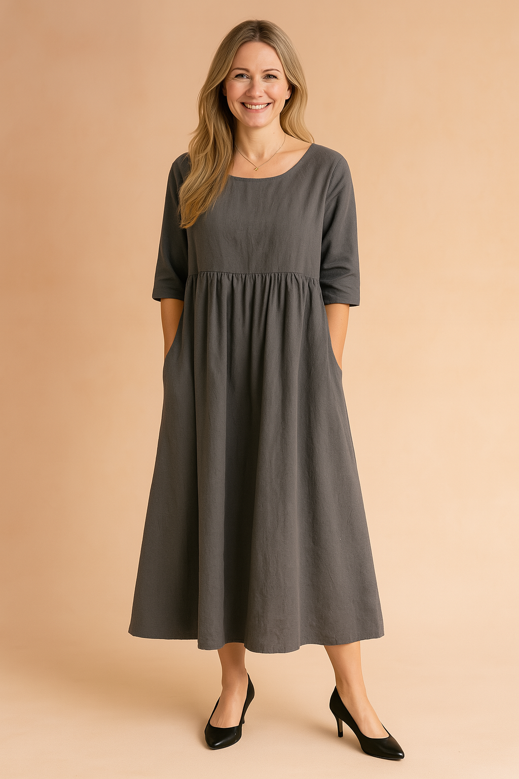 Women's half-sleeve midi dress with convenient pockets & a comfortable A-line fit. Ideal for casual summer elegance.