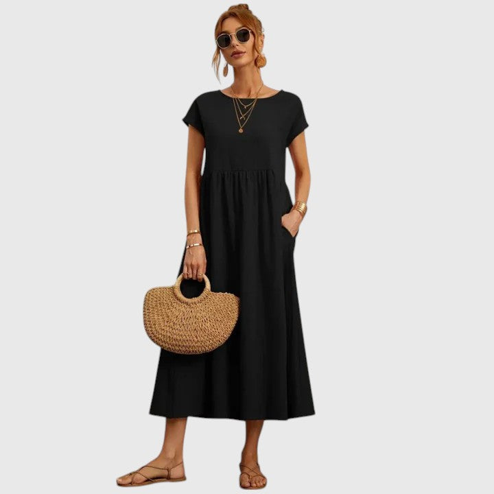 Chic women's flowy midi dress, short sleeve, featuring practical pockets for versatility.