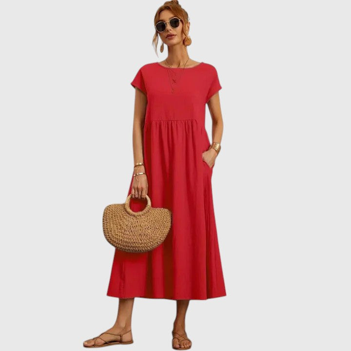 Comfortable women's flowy midi dress with practical pockets for casual wear.