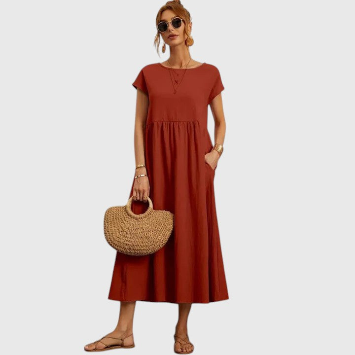 Summer-ready women's midi dress, comfortable, flowy, and features convenient pockets.