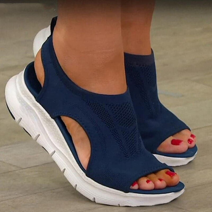 Women's comfortable open-toe spring sandals. Versatile slip-on casual footwear for everyday style.