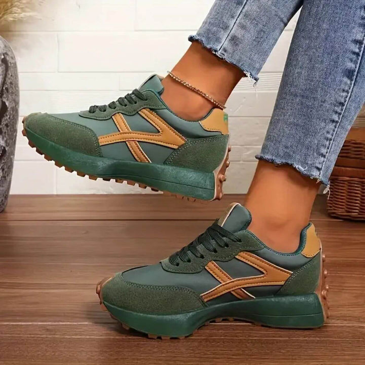 Pair of women's walking shoes with excellent orthopedic arch support, breathable upper, and cushioned sole.