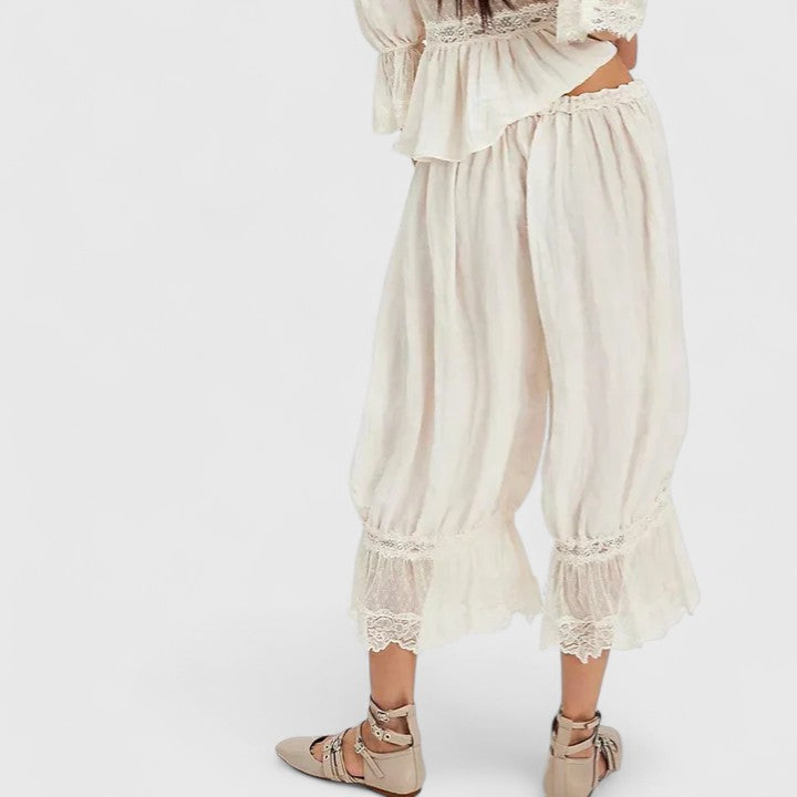 Mid-rise women's comfortable trousers showcasing intricate patchwork lace details, perfect for a stylish look.