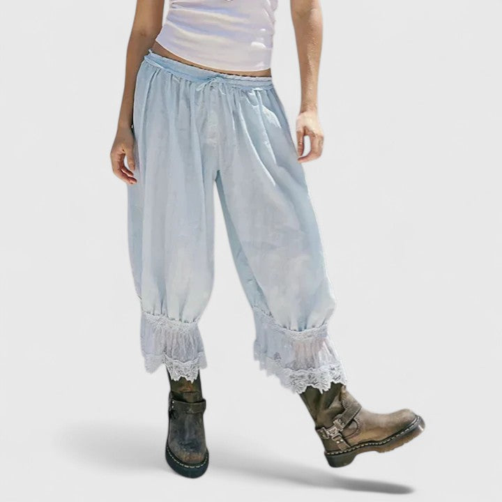 Fabric detail of soft women's comfortable pants showing delicate patchwork lace & quality material.