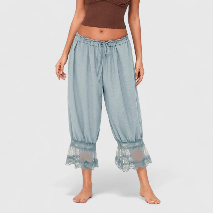 Chic women's patchwork lace trousers, loose fit streetwear style, offering ultimate comfort & style.