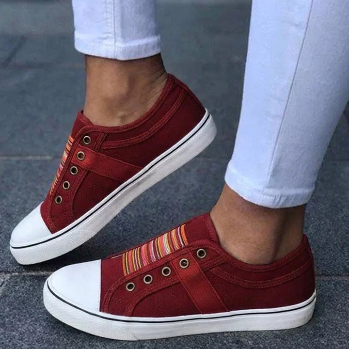 Trendy women's everyday slip-on footwear in a versatile red shade, offering ultimate comfort.