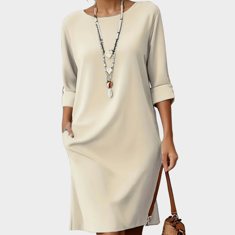 Elegant women's casual midi dress with a comfortable round neck. Everyday fashion.