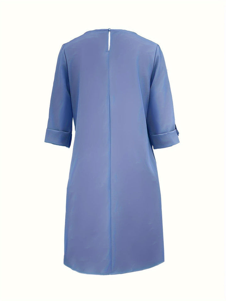 Everyday elegant women's midi dress featuring a comfortable round neck. Easy slip-on style.