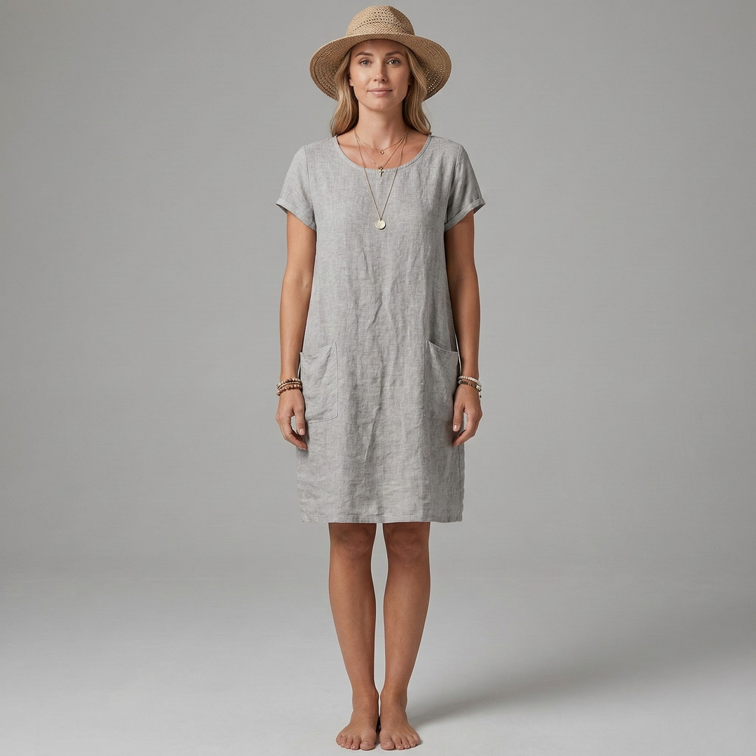 Model wearing a comfortable women's short sleeve mini dress with pockets, a versatile casual summer outfit.