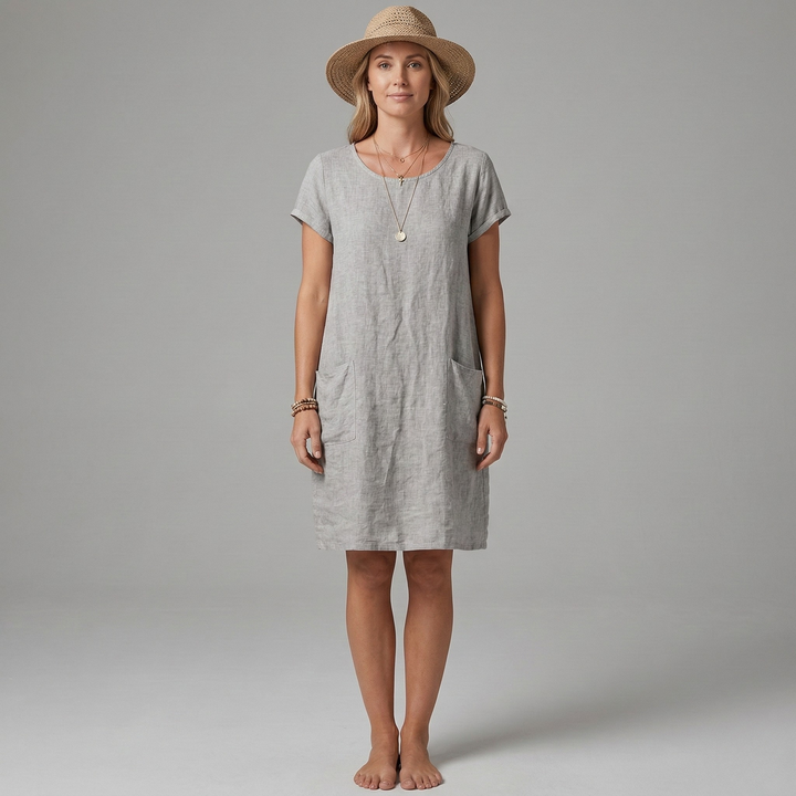 Model wearing a comfortable women's short sleeve mini dress with pockets, a versatile casual summer outfit.