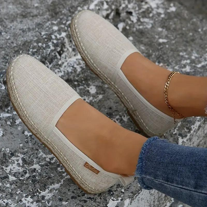 Stylish women's espadrille flat shoes with a rope sole, ideal for summer holidays & warm weather.