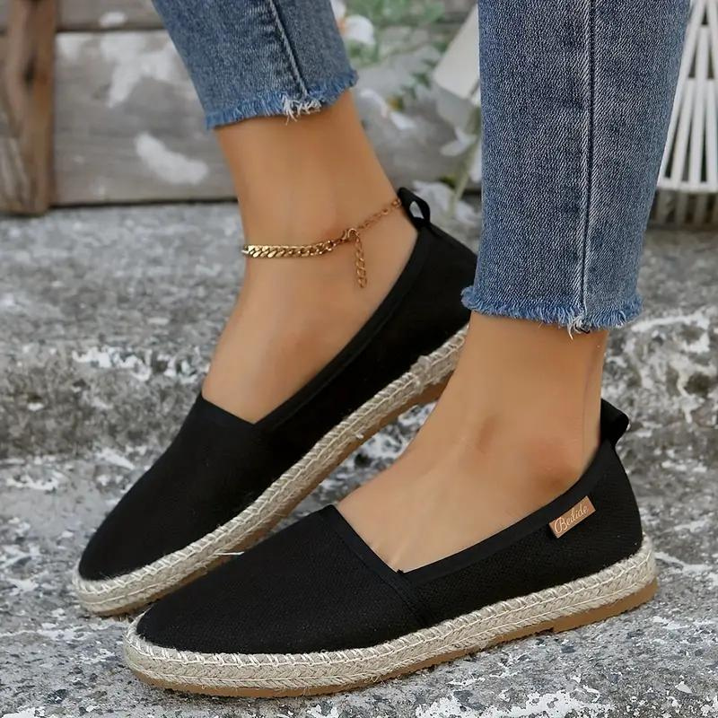 Classic women's espadrille flat shoes for summer. Comfortable, breathable, and versatile casual footwear.