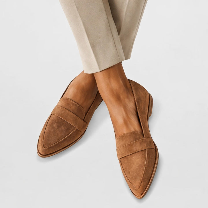 Women's comfortable slip-on loafers in black, perfect for everyday casual or office wear. Elegant pointed-toe flats.