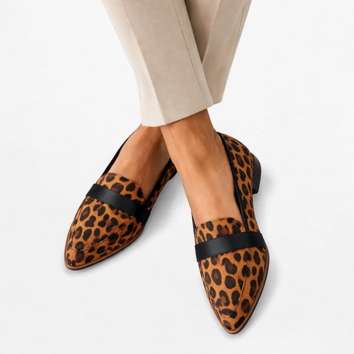 Black women's slip-on loafers, elegant and comfortable pointed-toe flats for effortless style and all-day wear.